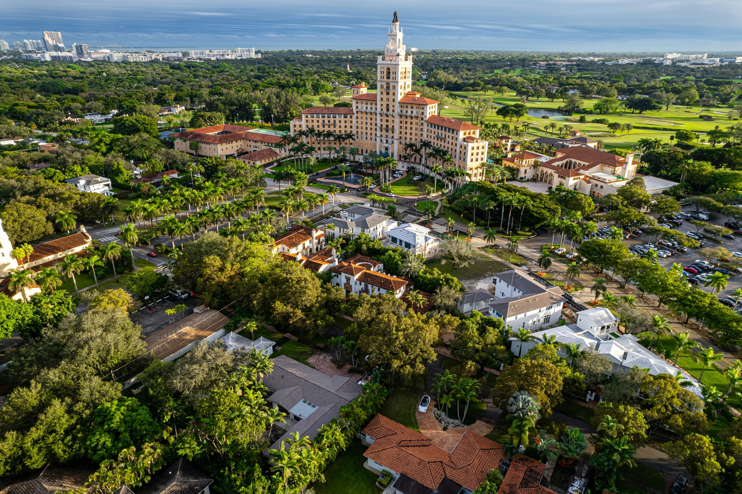 Aerial view of the Biltmore Hotel and tree-lined neighborhoods in Coral Gables